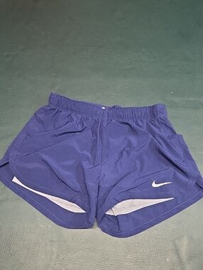 **Nike Women’s Purple Athletic Running Shorts with White Accents**